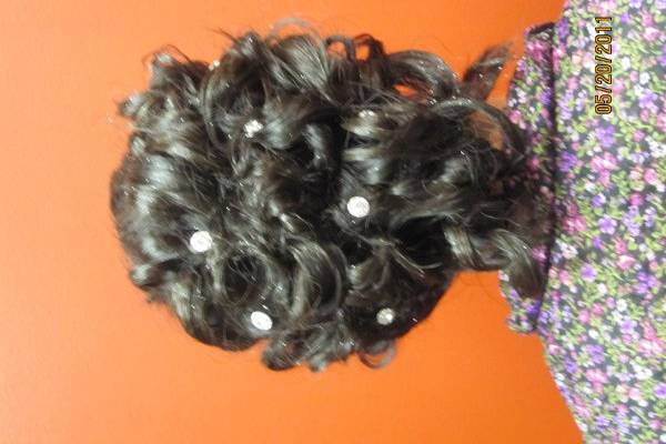 Pinned up curls with suspended gem stones