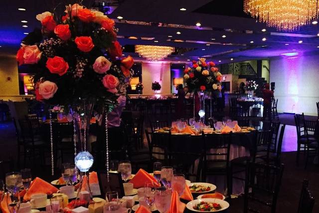 Table setting and raised floral centerpieces