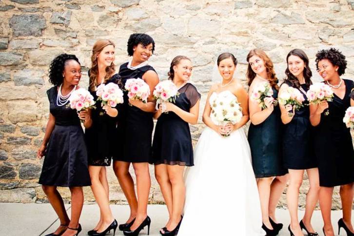 Bride holding her bouquetwith her bridesmaid