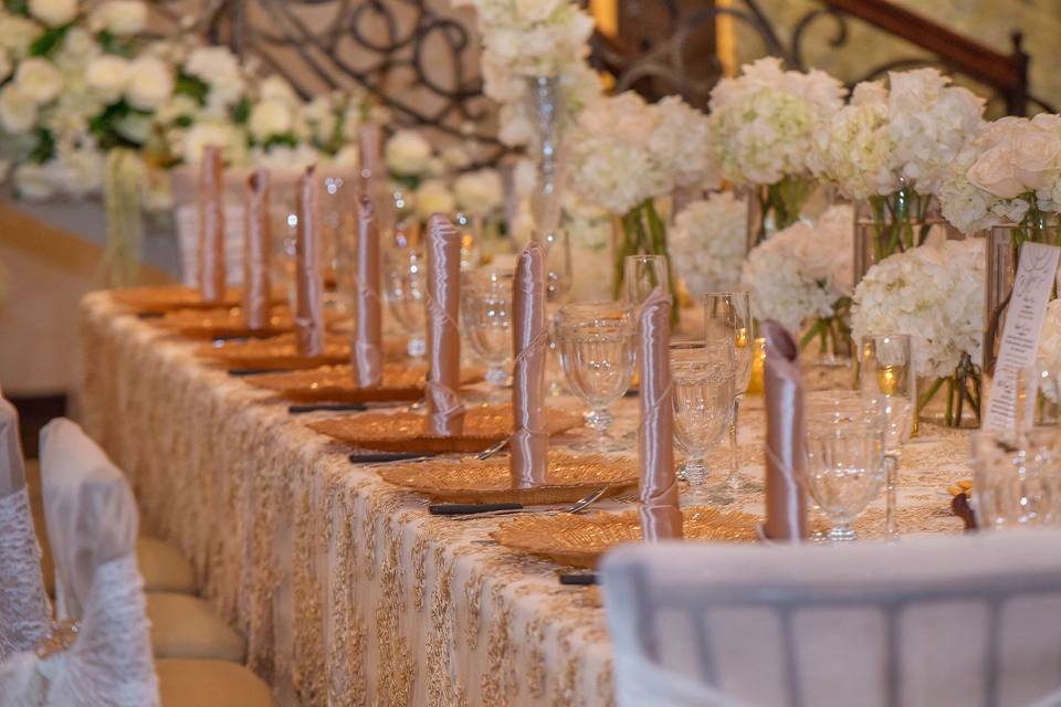 Table setting with floral centerpieces
