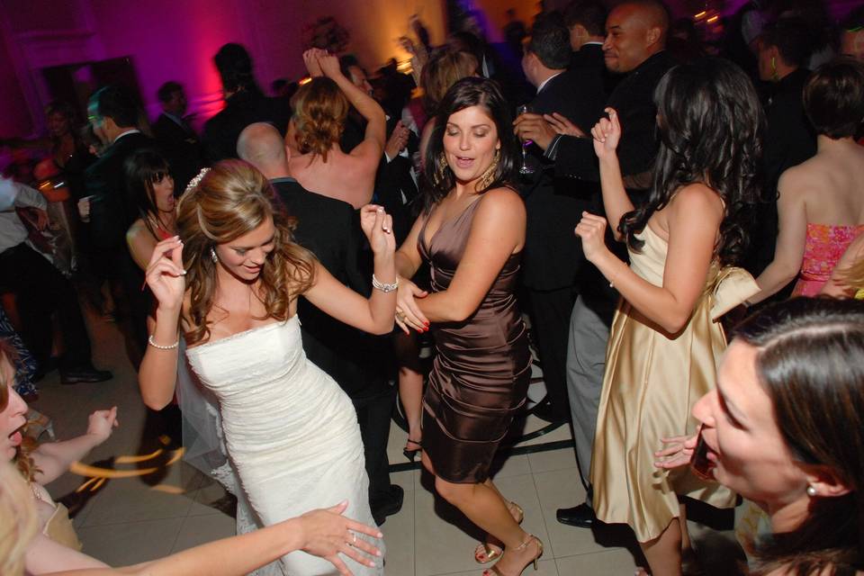 The bride dancing with their guests