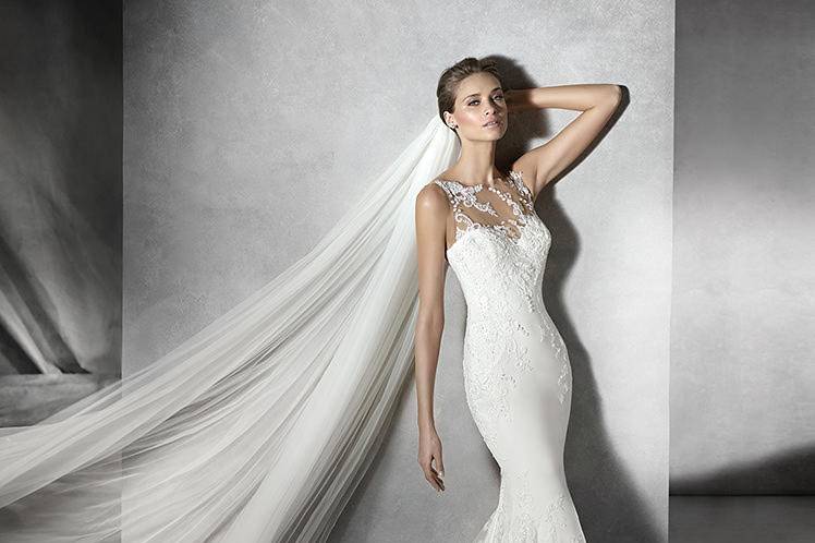 Lace flowing off the shoulder wedding dress