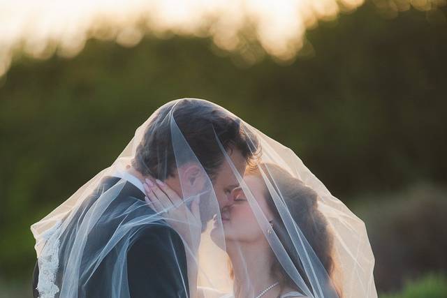 Bride and Groom under veil