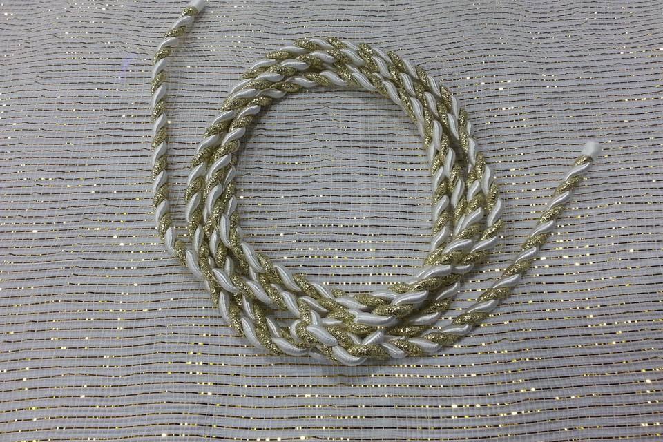 Gold/White Handfasting Cord from military ceremony, after the knot was tied.