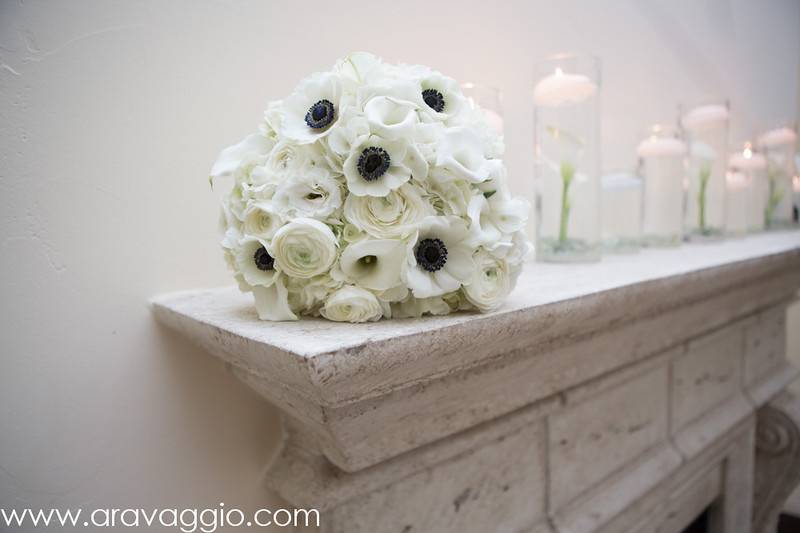 All white bouquet of hydrangea, anemone, ranunculus, calla lilies, and lisianthus