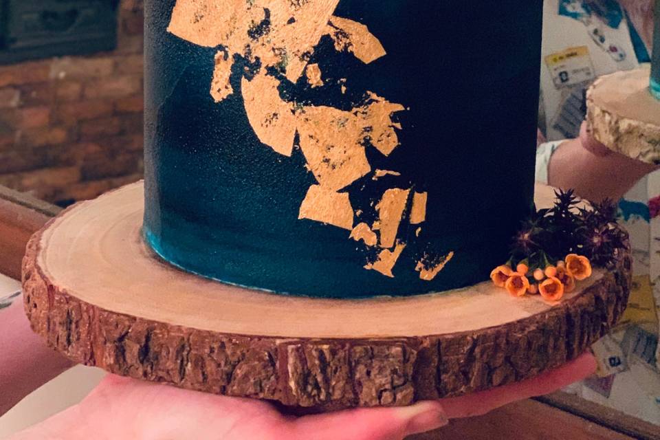 Moody cake with gold leaf