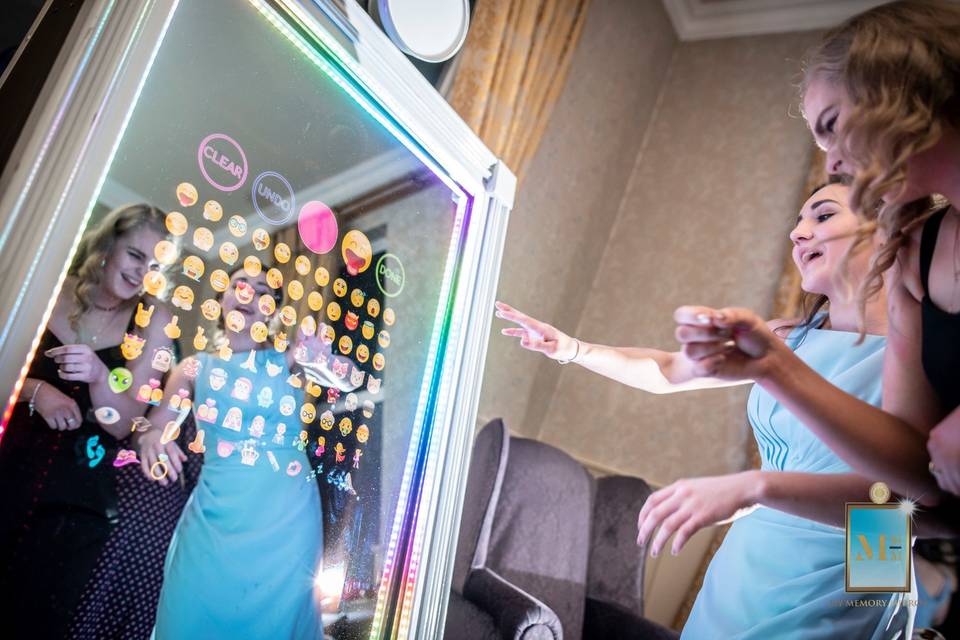 Touchscreen mirror booth with emojis