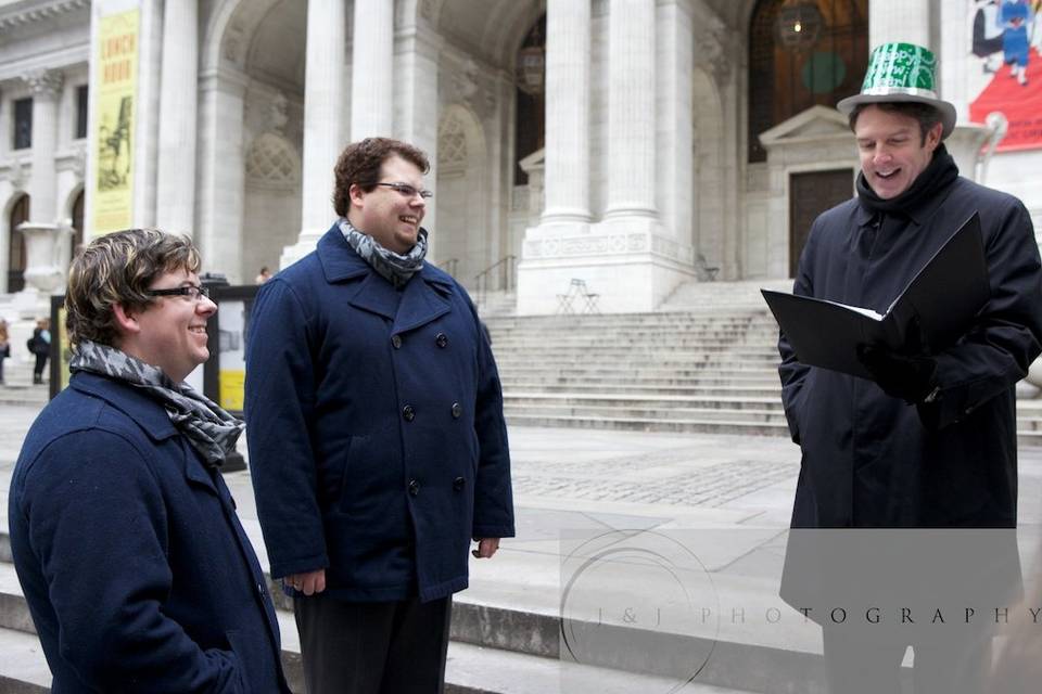 I led Trevor & Evan on a 'Wedding Walking Tour', with stops at the New York Public Library, Bryant Park, 5th Avenue, and Rockefeller Center. We did each part of their ceremony at a different stop along the tour. At Rockefeller Center, we had a group of onlookers cheering.