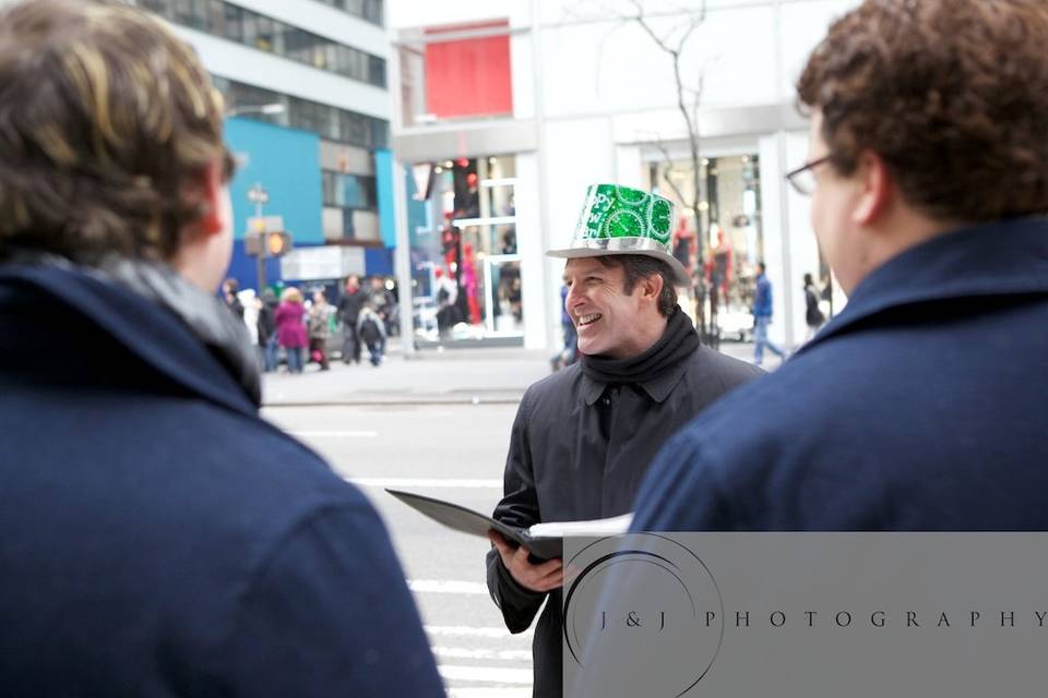 I led Trevor & Evan on a 'Wedding Walking Tour', with stops at the New York Public Library, Bryant Park, 5th Avenue, and Rockefeller Center. We did each part of their ceremony at a different stop along the tour. At Rockefeller Center, we had a group of onlookers cheering.