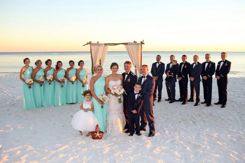 The couple with the bridesmaids and groomsmen