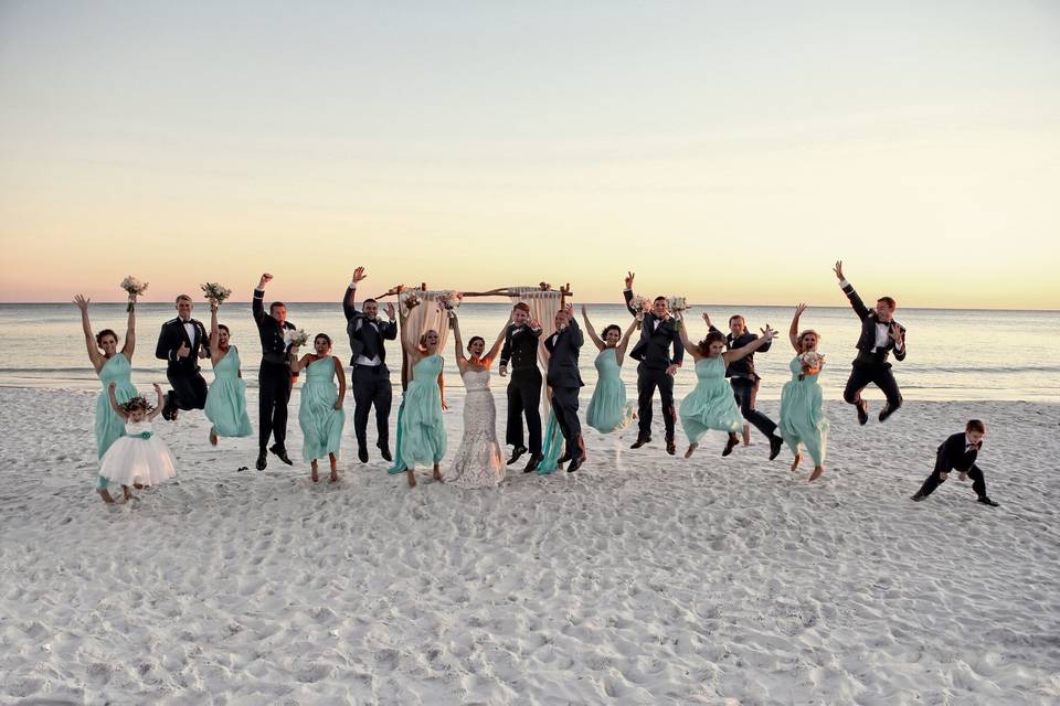 The couple with the bridesmaids and groomsmen