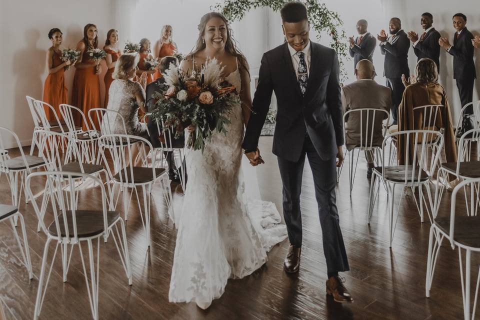 Couple Exits Ceremony Site