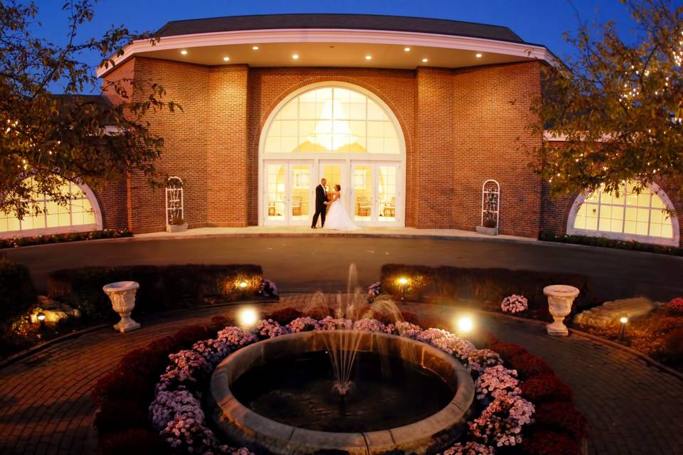 Couples dance in view of venue