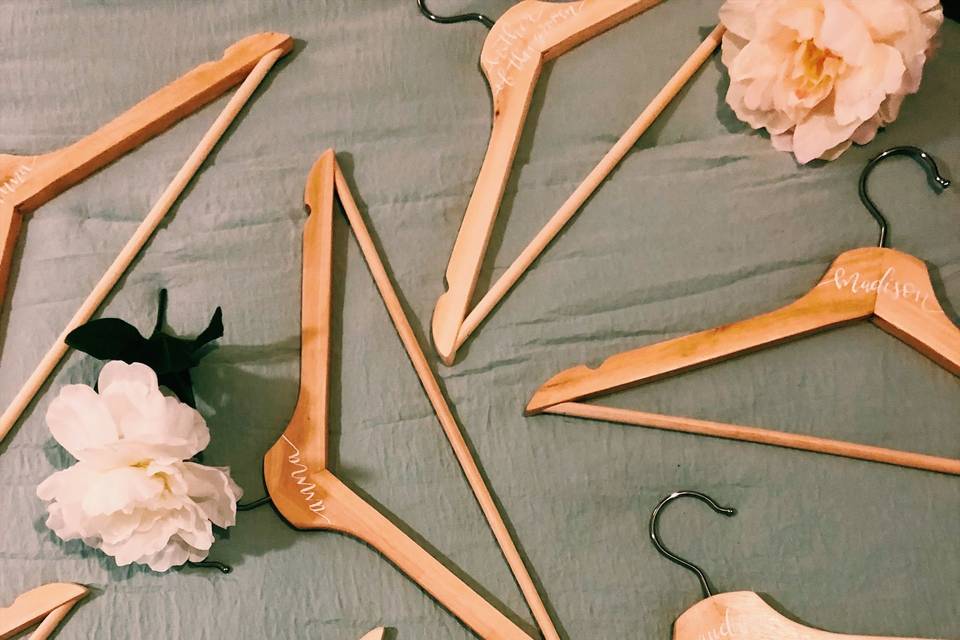Dip pen calligraphy on hangers for bridal party