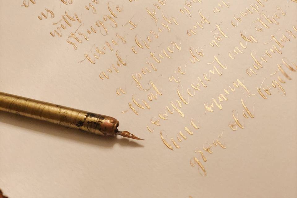 Dip pen calligraphy in gold ink