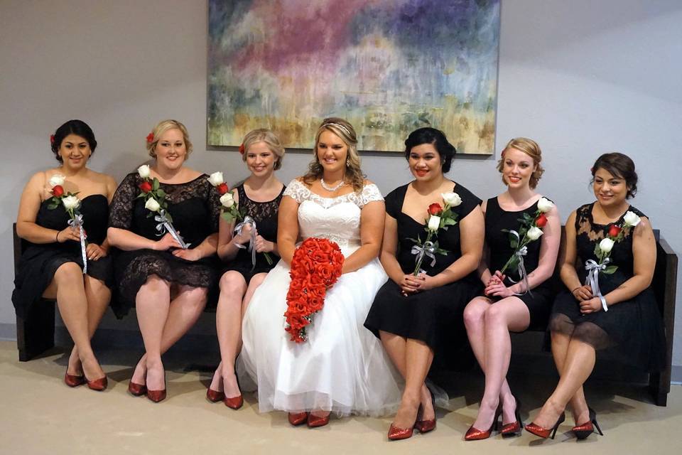 Bride sitting with her bridesmaids