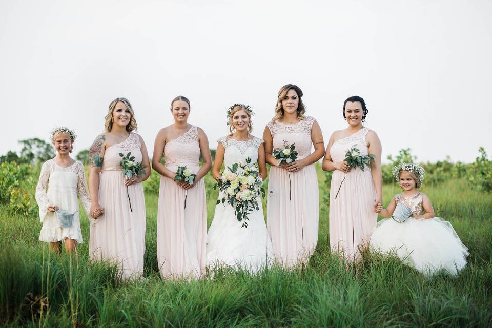 Bride with her bridesmaids and flower girl