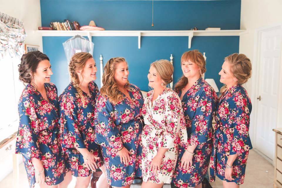 Bride and bridesmaids in floral robes