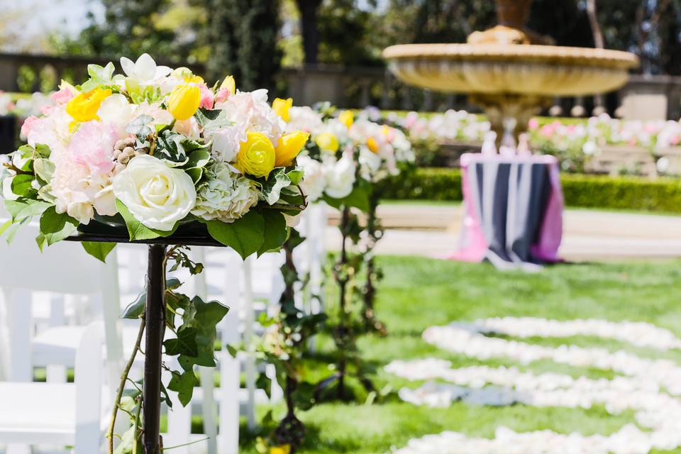 Ceremony Decor. Tall vine aisle floral arrangement and petal aisle runner. Sheena & Keith Beverly Hills Wedding Ceremony @Greystone Mansion (Gavin Farrington Photography)