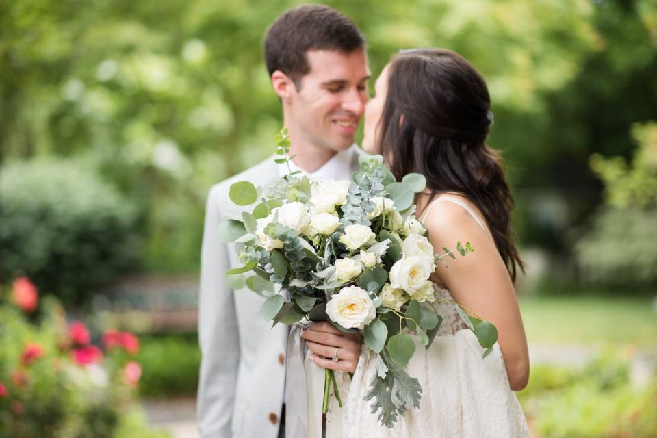 Candid bride and groom kiss