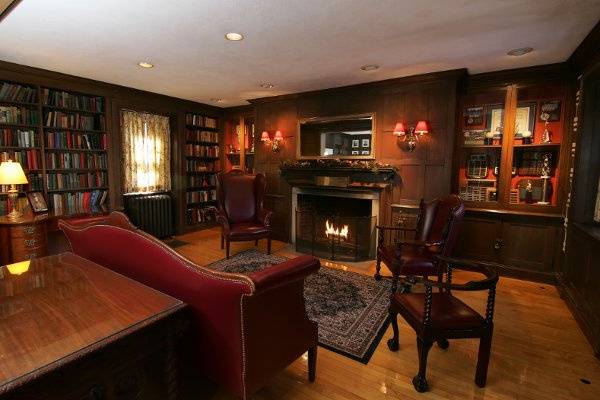 Original oak-paneled Library with working fireplaceThe Library comfortably fits 20 more guests for seated dining and 30 more for a cocktail reception.  Photograph courtesy of Underwood Photography