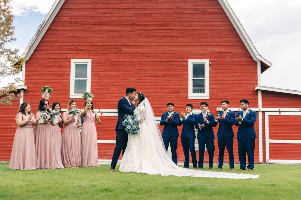 Wedding party in front of barn
