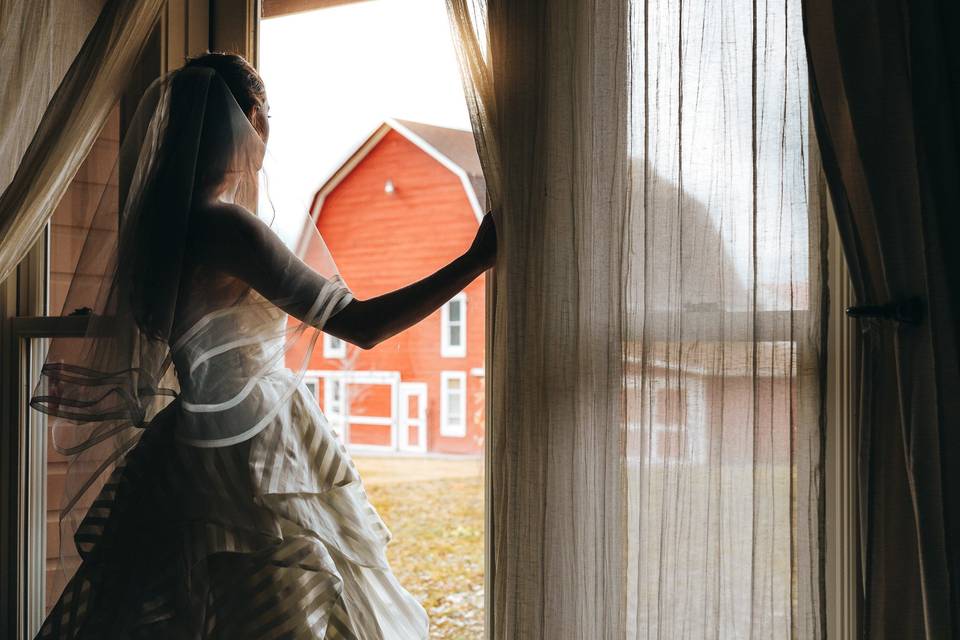 Bride in cottage window