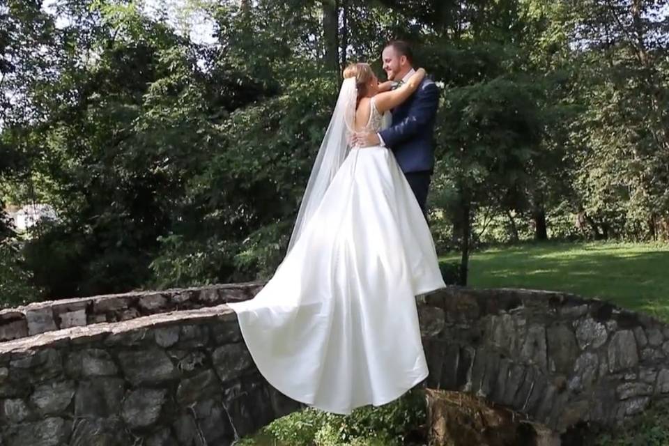 Newlyweds on a bridge