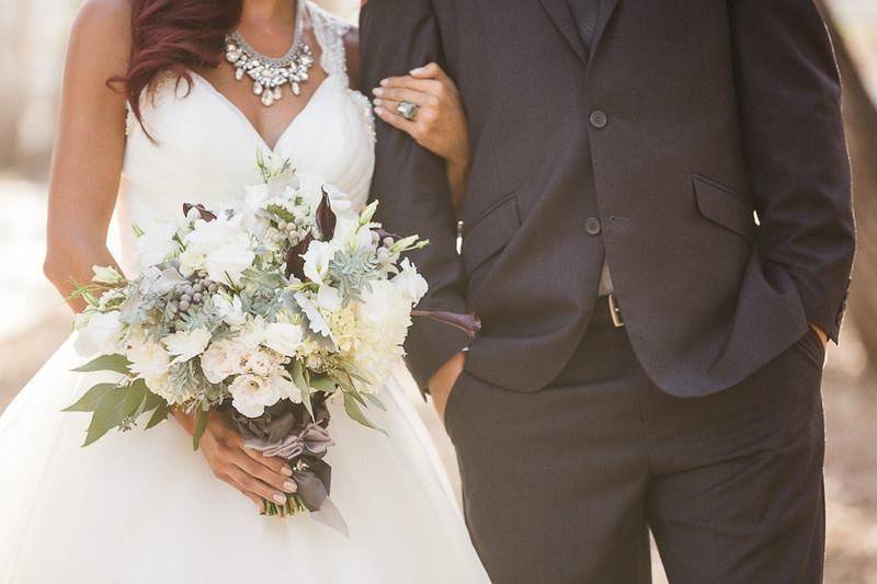 The bride is wearing the Crystal Cluster Drama Necklace