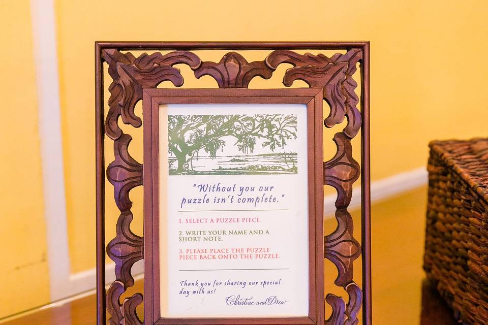 A custom jigsaw puzzle doubles as a guest book. It's a map of South Carolina, Lowndes Grove Plantation the centerpiece, and guests sign the back of the puzzle pieces. It's a wonderful addition to the decor of their first house.