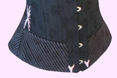 1890's style corset in black jacquard with pink embroidery and trim