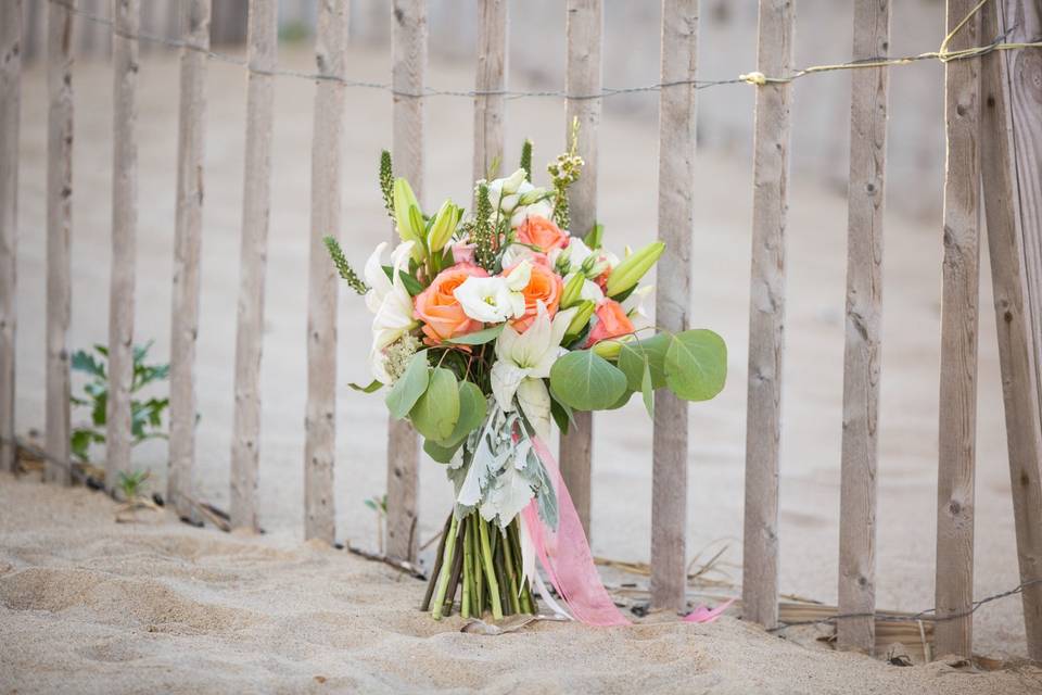 Gorgeous coral bouquet for a beach bride