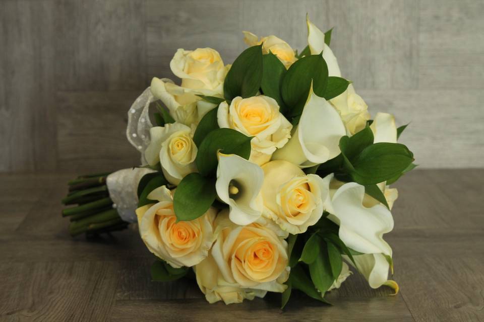 Yellow roses and Calla Lilies