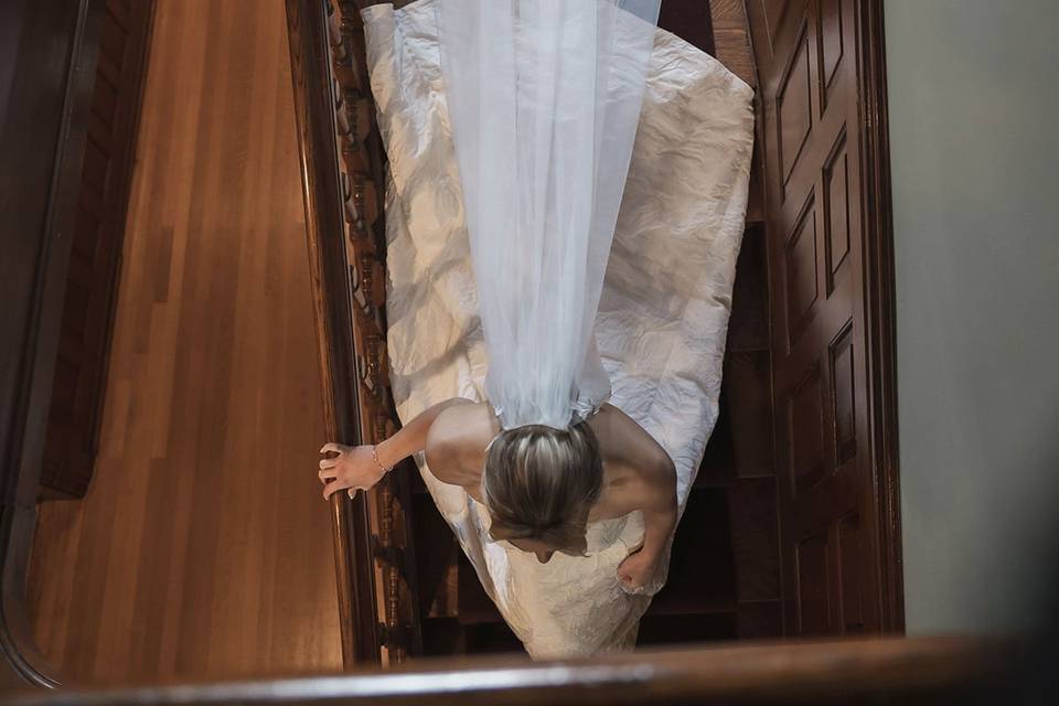 Bride with veil on stairs