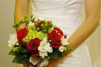 Red roses, green hydrangea bridal bouquet by Loeffler's Flowers