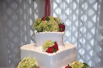 Cake flowers of green hydrangeas and strawberries by Loeffler's Flowers