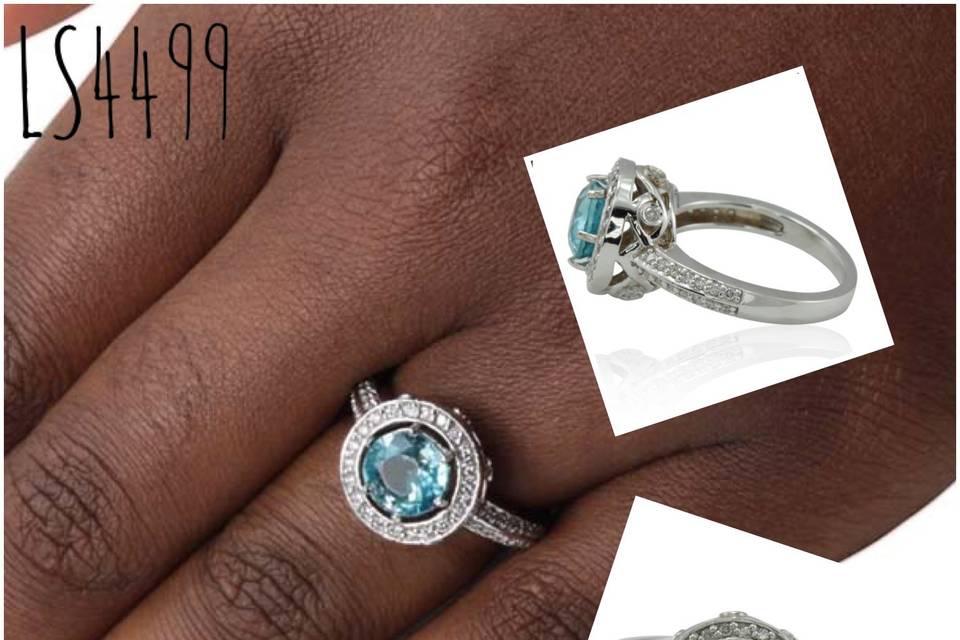 A beautiful diamond halo ring with a beautiful blue zircon stone!
See full details here:
https://www.lauriesarahdesigns.com/product/diamond-halo-ring-round-blue-zircon-knife-edge-shank/