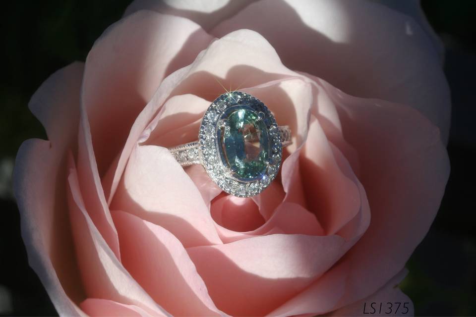Enjoy this stunning oval green sapphire engagement ring with a pave diamond halo!
See full details here:
https://www.lauriesarahdesigns.com/product/sapphire-ring-oval-green-sapphire-pave-diamond-halo/