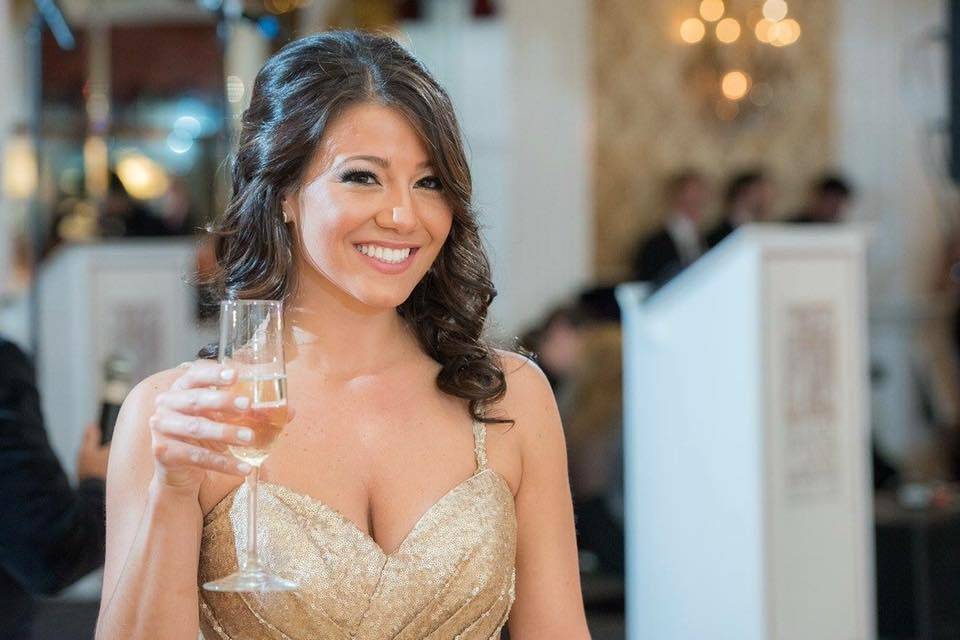 Bride holding up her drink