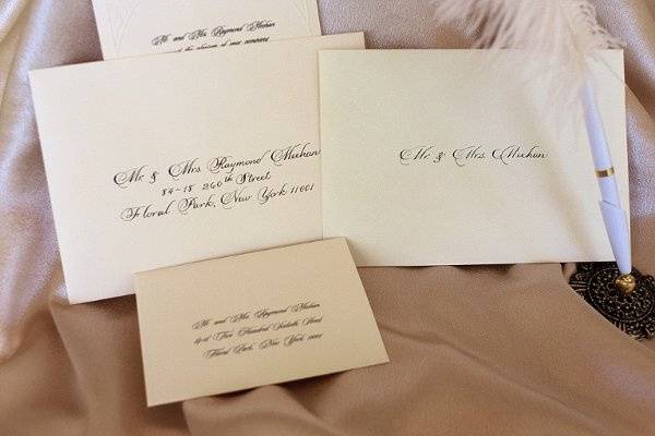 Set of envlopes addressed in the calligraphic style of the invitation.