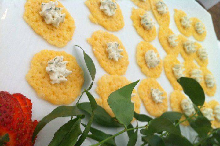 Parmesan crisps: baked parmigiano reggiano cheese topped with a dill goat cheese