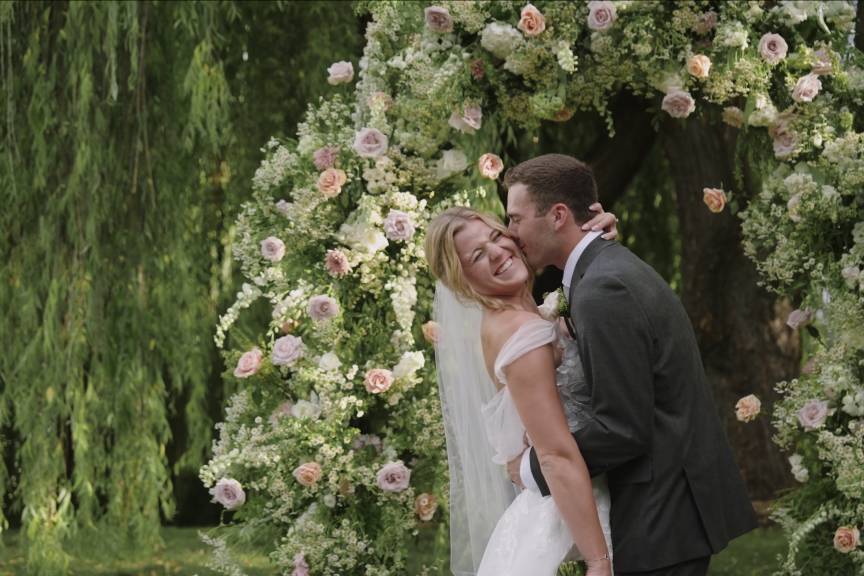 Outdoor wedding by willow pond