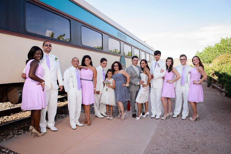 Wedding party waiting to board the train during a spring wedding.