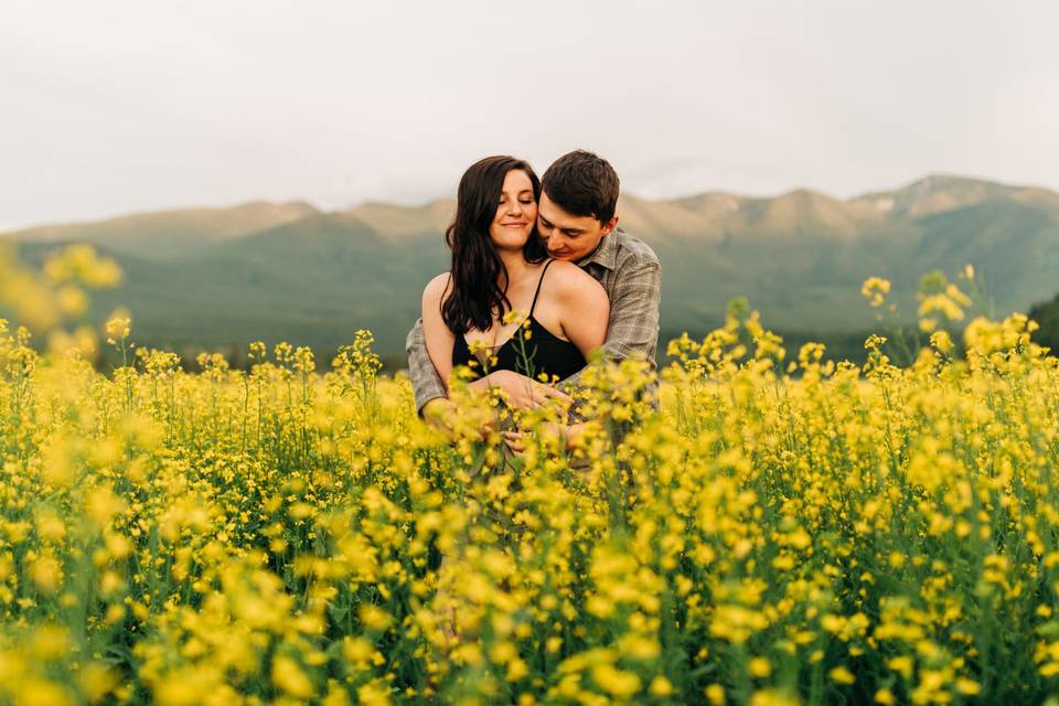 Happy couple in a field of flowers