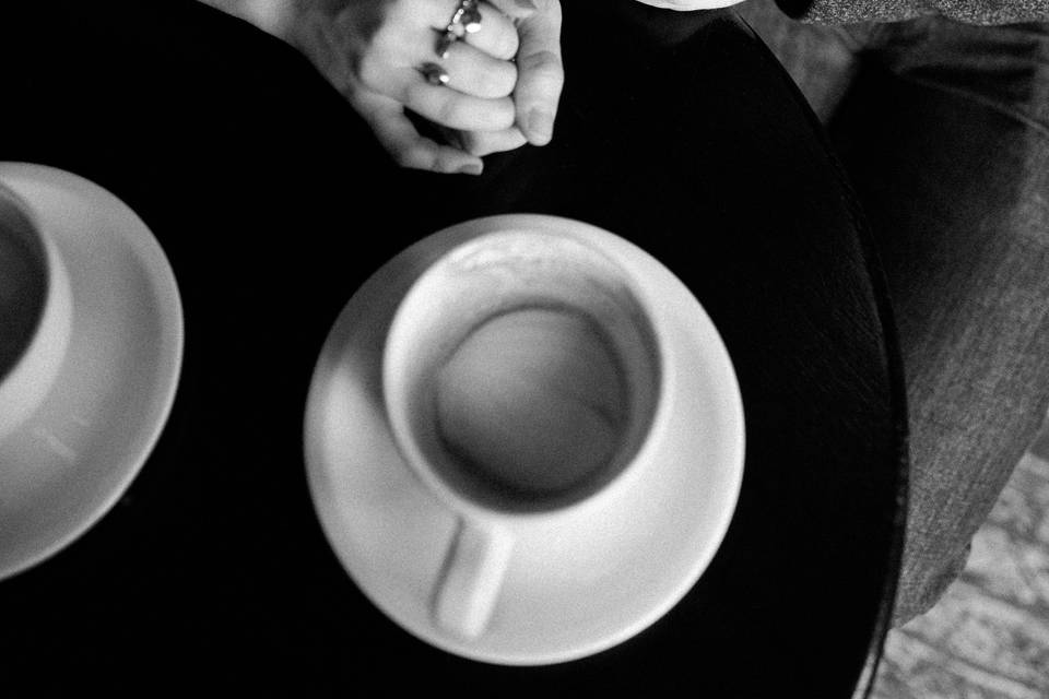 Happy couple enjoying cups of coffee
