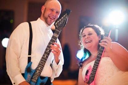 Couple playing guitars