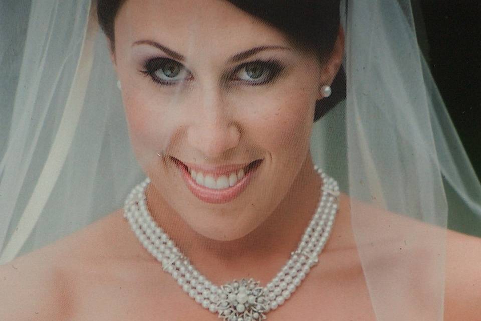 Real bride wearing a multi Swarovski crystal pearl collar necklace with vintage brooch style focal point. Wear beyond your gown!