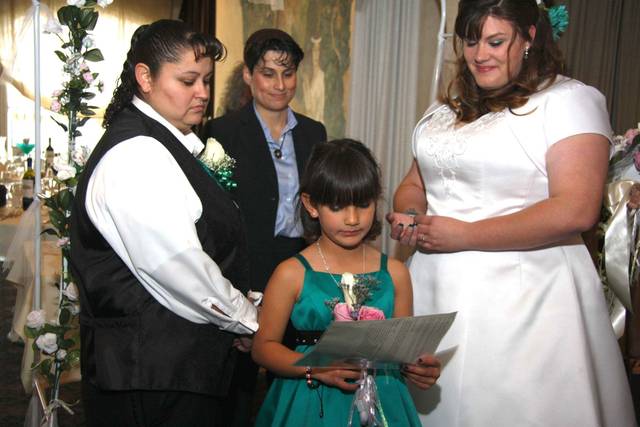 Flower girl reading at ceremony