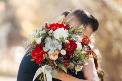 Embracing with a bouquet