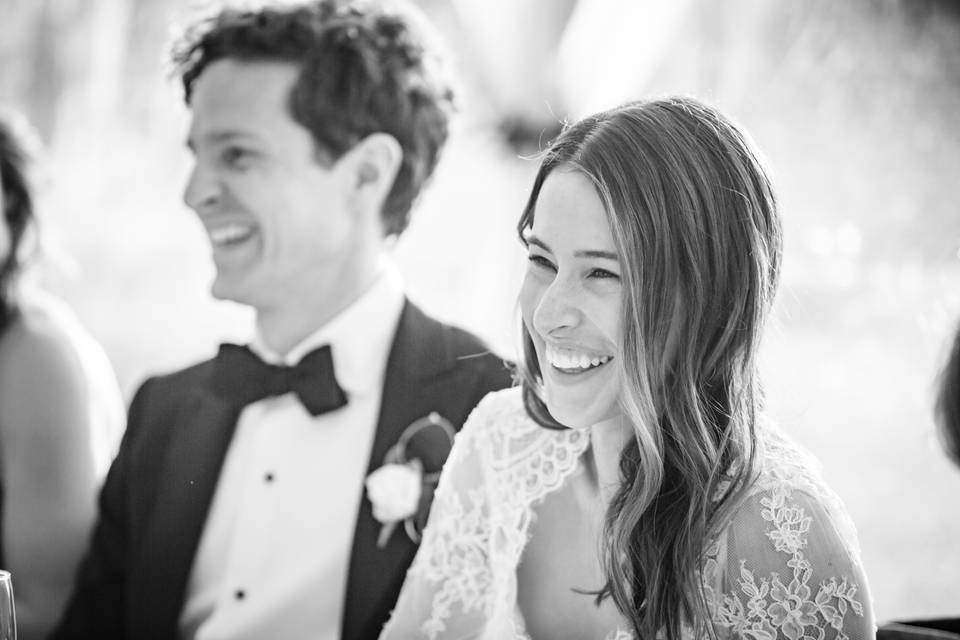 Bride laughing during toast